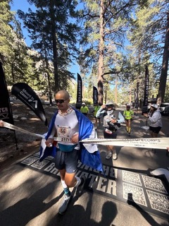 Danny Manimbo crossing finish line at Badwater 2025